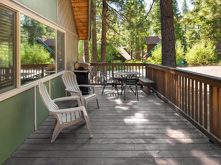 Private deck with outdoor dining table, gas bbq, & Adirondack chairs.
