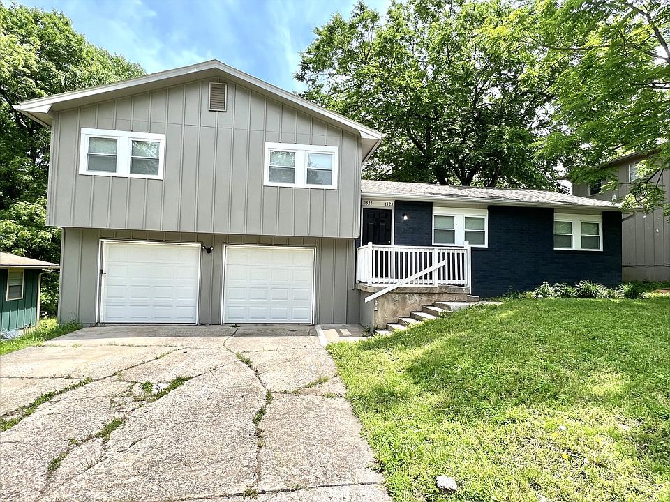 DUPLEX w/ shared main entry for both units. 
1323 = Blue side, 1325 = Gray side.