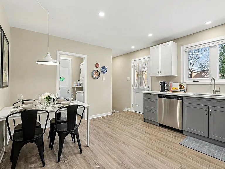 Seamless flow from the dining area to the fully stocked kitchen in our Ottawa furnished rental.