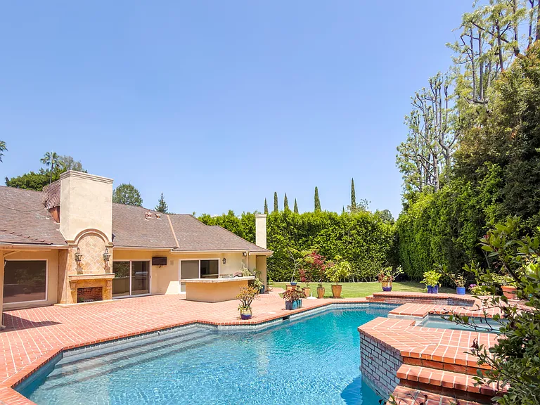 Lush mature landscaping surrounds this private pool oasis at this Beverly Hills luxury rental, 1094 Garden Lane, a tranquil 90210 home for rent.