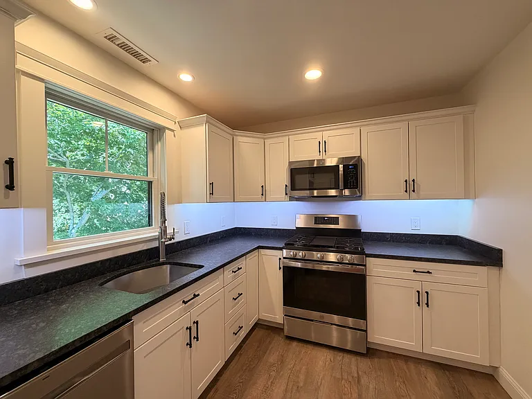 Modern Updates & Appliances - Gas Stove, Microwave, Dishwasher, Under Cabinet Lights that Change Color, Leathered Granite Countertops, Refrigerator etc.