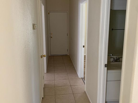 Hallway to two bedrooms, hall bath and garage
