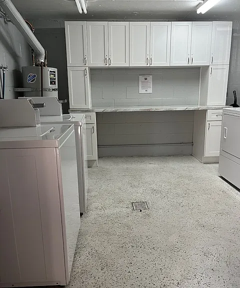Laundry Room w/ personal cabinets 
2 washers and 2 dryers