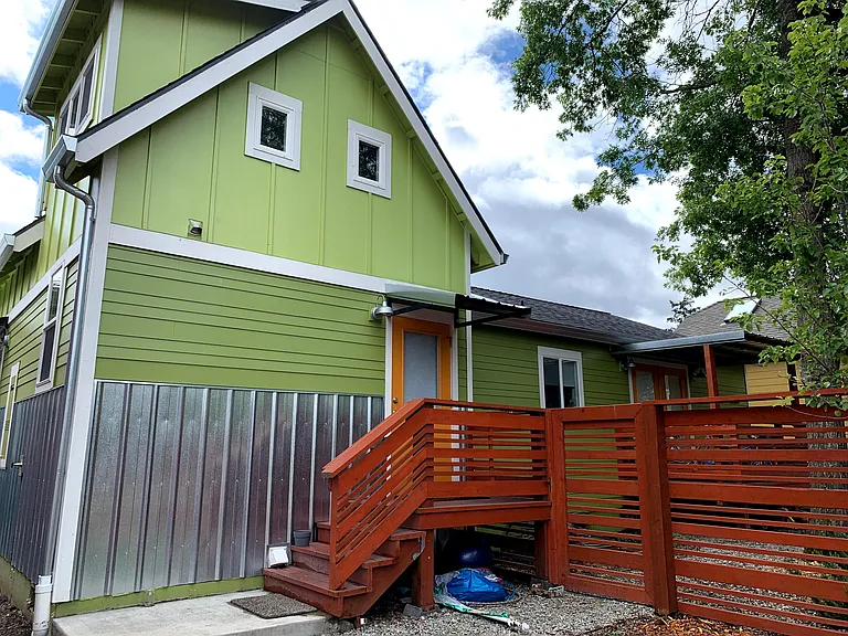 Small fenced yard on west side of home