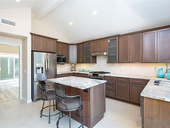 Gorgeous Custom Kitchen with Kraftmaid Cabinetry, Pull Out Shelves, high end Granite, new sliding doors, new Stainless Steel appliances, lighting
