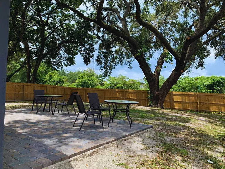 Spacious Patio with Table & Comfortable Seating.