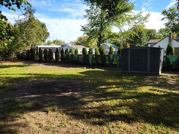 Large backyard with shed for storage