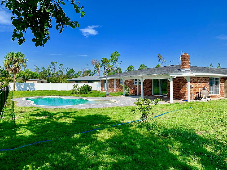 Backyard on lake with pool