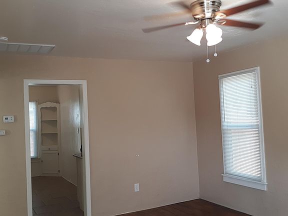Living room with hardwood floors & ceiling fan