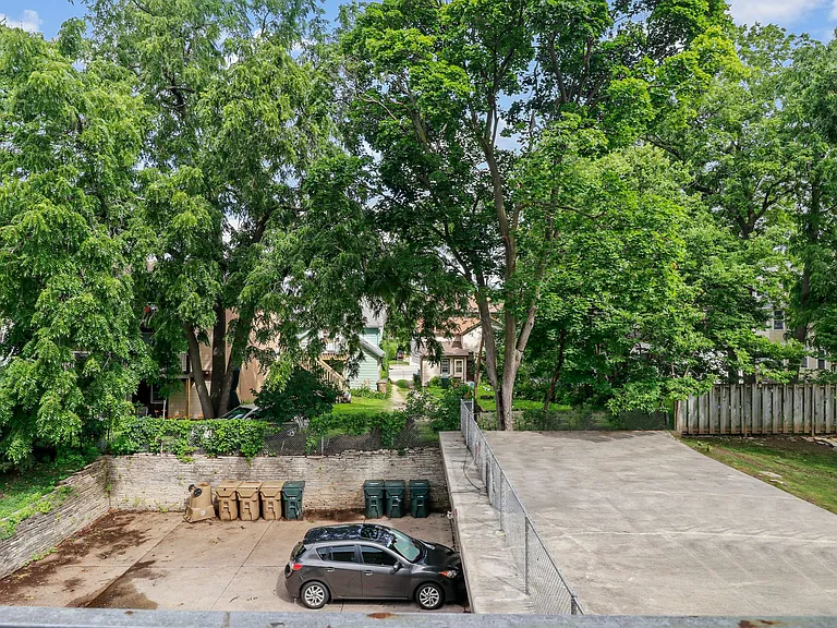 This shot shows the large parking space in the back. Each unit has two spaces - one in the garage and one behind it.