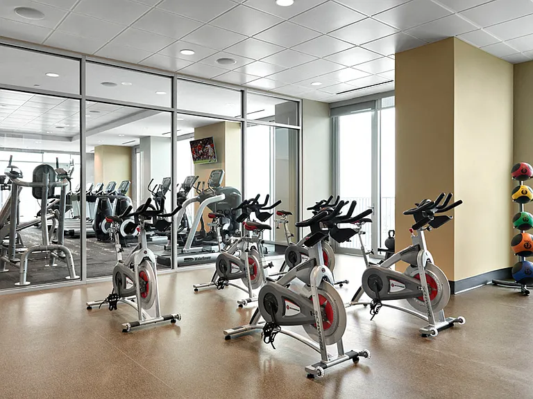 Fitness studio with spin bikes and virtual trainer