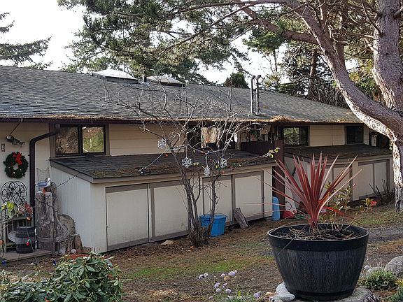 Back of the duplex that faces the road and parking (2 units in the duplex - #A and #B)