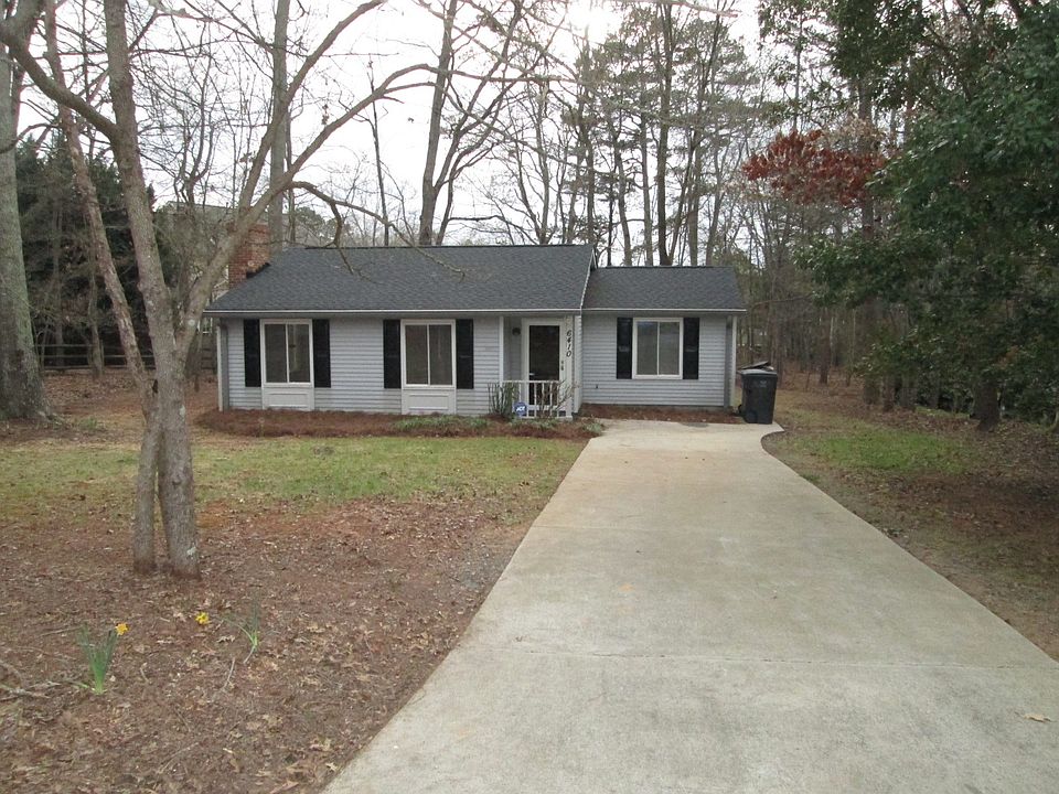 adorable bungalow surrownded by trees