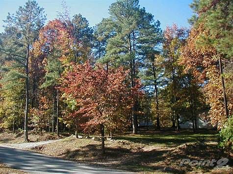 Welcome to 111 Cimarron Drive! Note the newly graveled driveway on the left plus extra car or boat p