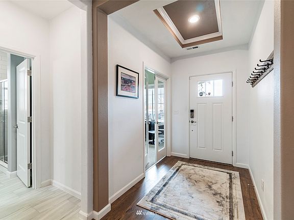 High detailed ceilings welcome you into this beautiful home.  Some of the home features are air conditioning, 30-amp RV hookup, Generator ready, tankless hot water heater just to name a few.