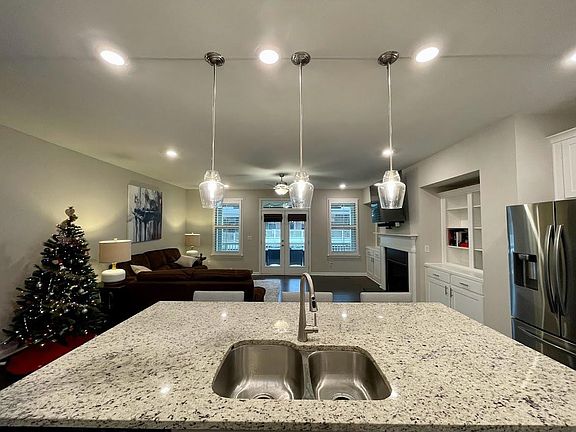 View of Living Room and attached outdoor deck from Kitchen