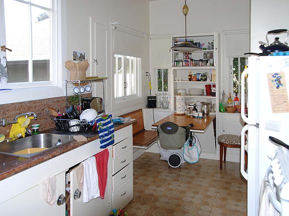 Spacious kitchen with built in table and benches. Light and airy.