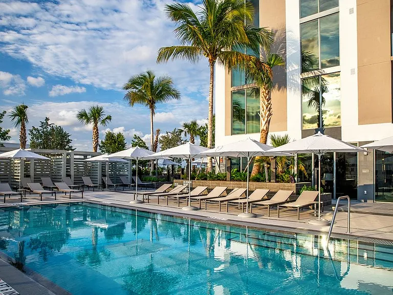 Infinity edge pool and sundeck with cabanas