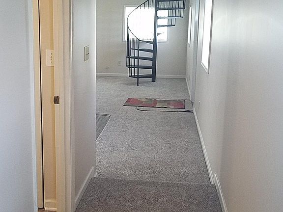 hallway leading to bathroom and bedrooms