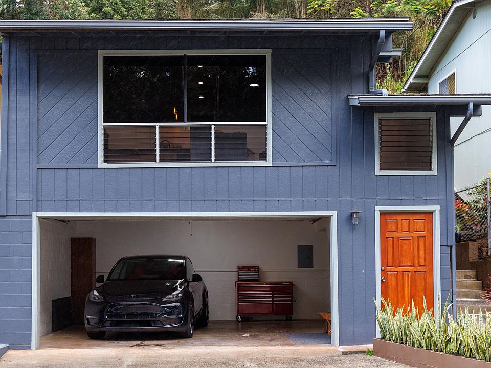 Two car garage with tinted windows for privacy.