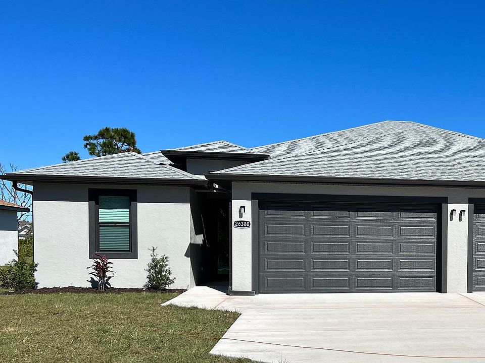 The unit is separated by a spacious 2 car garage and ample parking space.