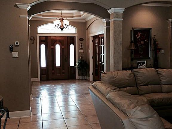Beautiful view of the  grand warm  entrance  . Home features ceramic title through out entire home.