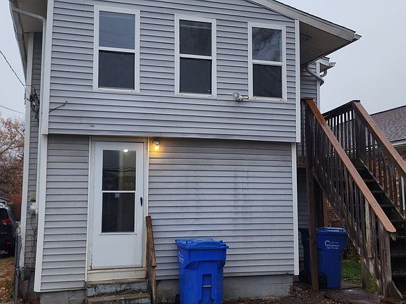 Back of the house with back entrance to the backyard