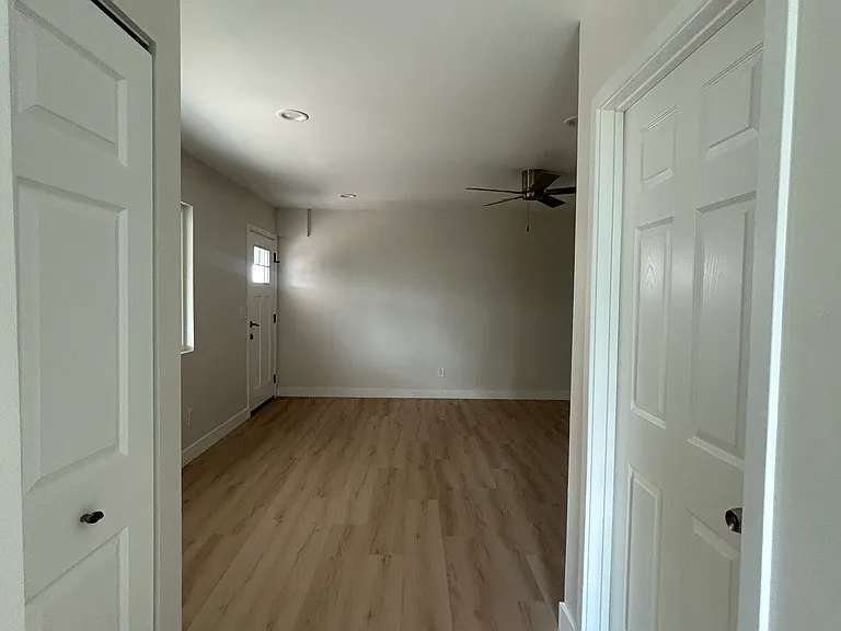 Beddroom to right and washer and dryer hook ups housed inside the left hand side closet -- stunning construction !