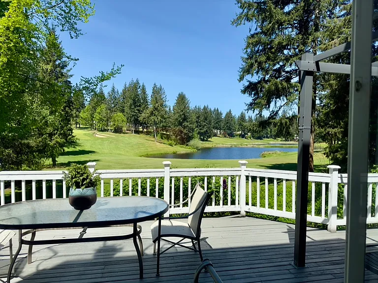 Back deck overlooking the golf course and pond