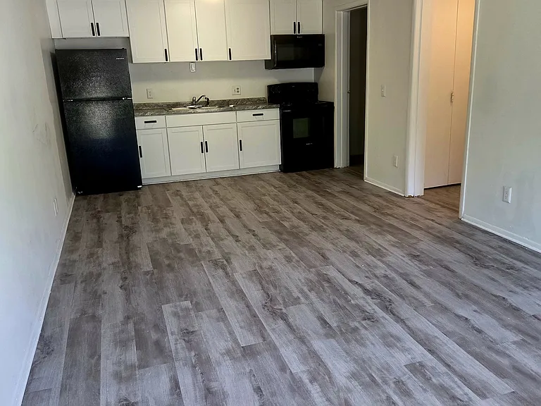 black appliances, refrigerator ,over the range microwave and stove