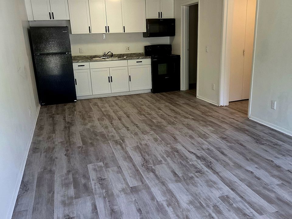 black appliances, refrigerator ,over the range microwave and stove