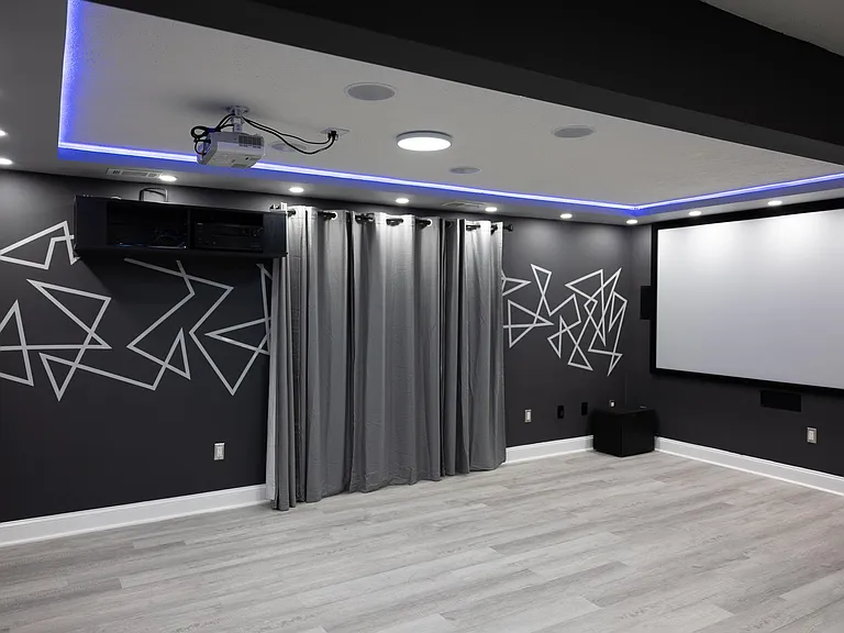 Basement has dimmable recessed led lamps and customizable led strip lighting for your perfect movie night.