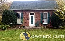 Front of home and 2 perinial gardenss