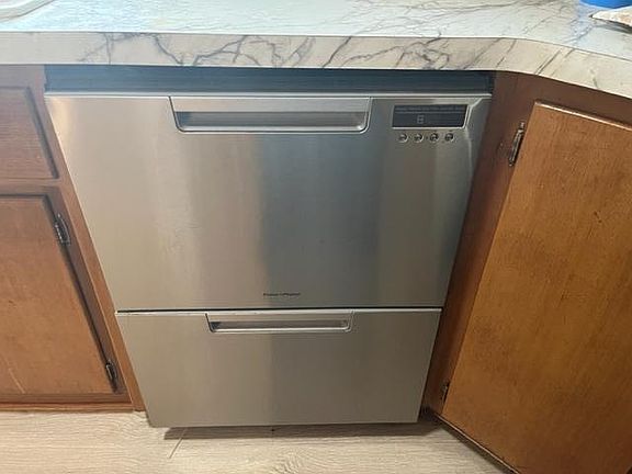 Stainless steel two drawer dishwasher.