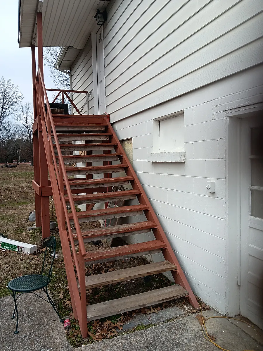 Stairs leading up to apartment entrance. - 1123 Yarbro Ln #985