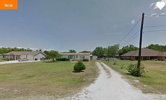 Home is on your own land, away from the road!
Detached garage in the back. Great for storage or a workshop.
