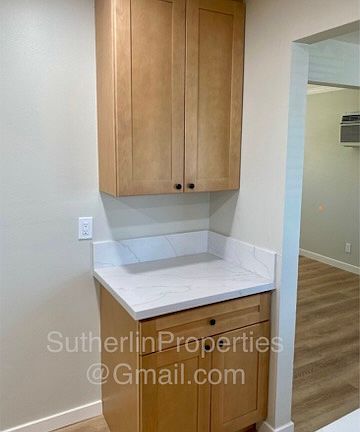 Kitchen view of appliance station - next to which the refrigerator goes