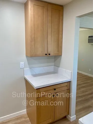 Kitchen view of appliance station - next to which the refrigerator goes
