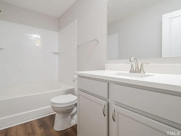 Master bathroom with updated appliances, large bath tub, and counter tops.