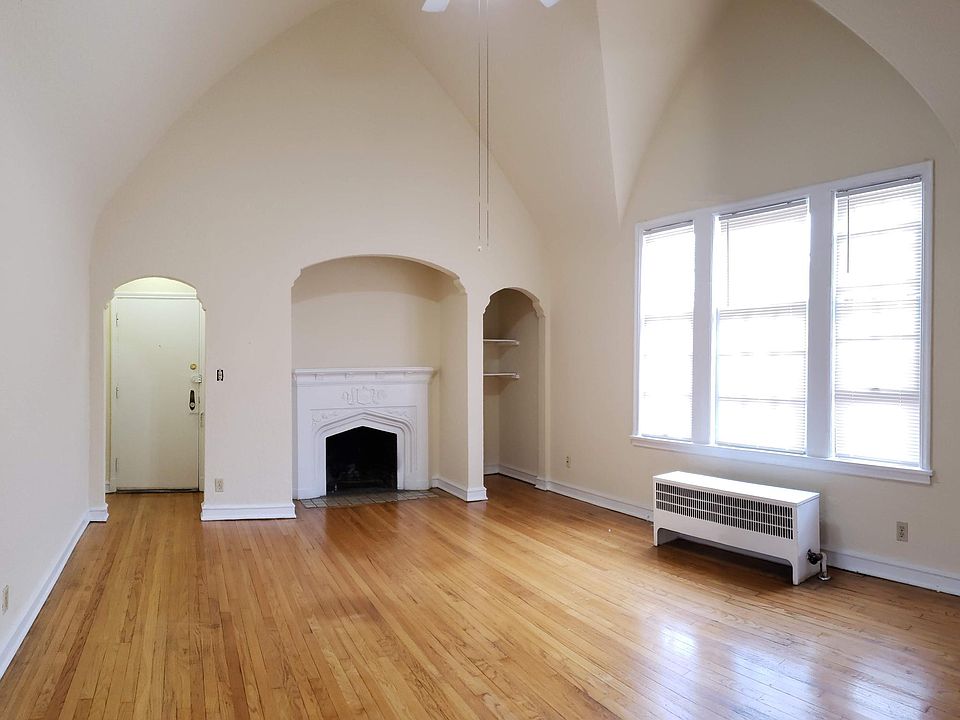 Dramatic vaulted living room loaded with natural light