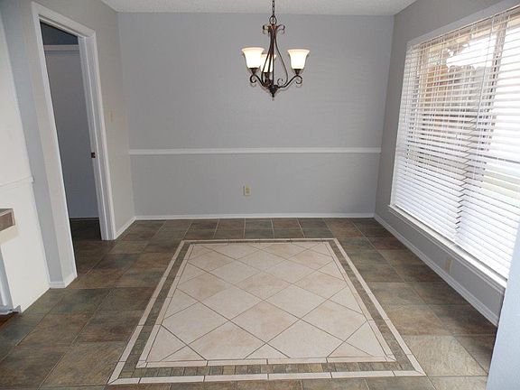 Beautiful tile inlay in dining room.