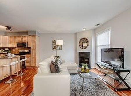 Open concept living room (photo from previous listing)
