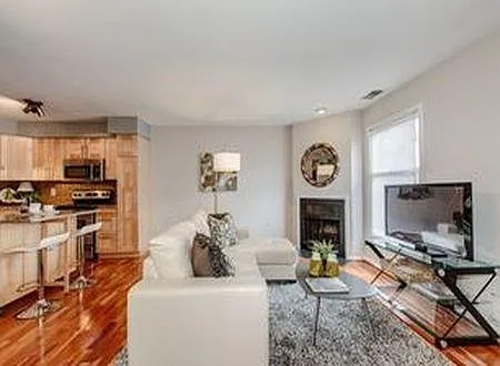 Open concept living room (photo from previous listing)