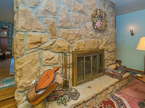 Beautiful Stone Fireplace, stone on all sides.