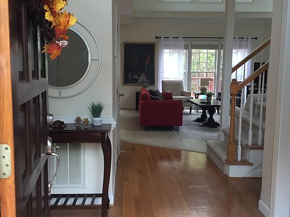 Entry with high ceilings and hardwood floors