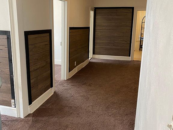 Going from LR into DR. First left is First bedroom. Second left is bathroom. Kitchen is straight ahead