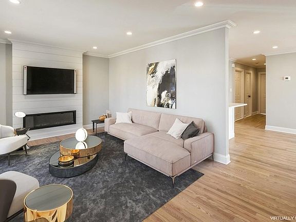 Living Room With Fireplace & 54" Flat-Screen TV