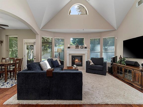 Gorgeous wood floors throughout main living space and high ceilings create an open and inviting space.