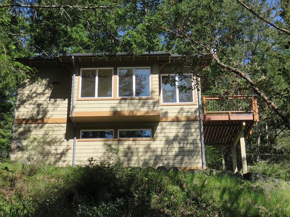 Cottage is on a 5-acre parcel shared with the owner. A dense screen of trees below assures privacy for both tenant and owner.