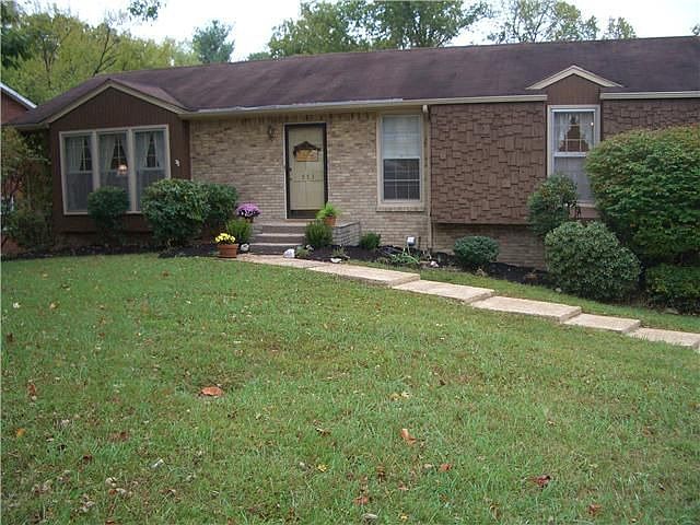 SPACIOUS BRICK HOME ON GENTLY SLOPING LOT. CONCRETE DRIVE. PLENTY OF PARKING